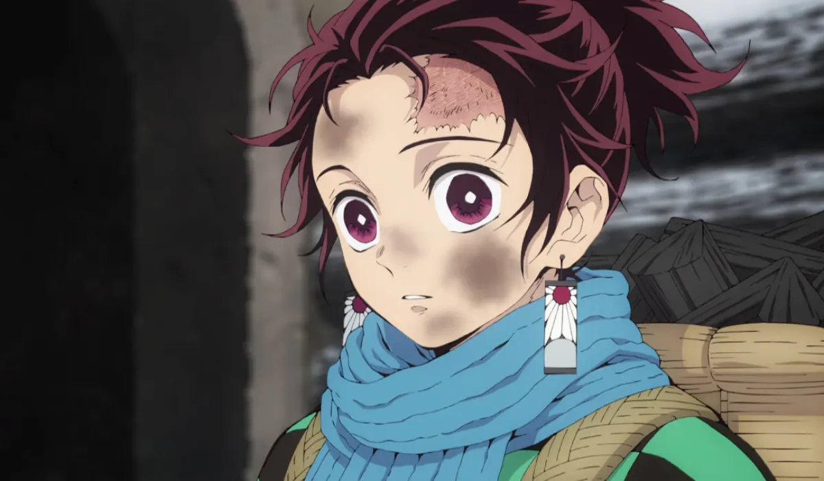 Tanjiro from Demon Slayer showing innocent expression before tragic family massacre in episode 1